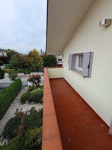 a balcony of a building with a window at Noventa Venice Apartment in Noventa di Piave