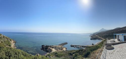 a view of a body of water from a cliff at The Rocas Hotel in Kérynia