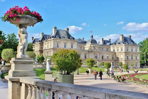 a large building with a statue in front of it at Hotel Observatoire Luxembourg in Paris