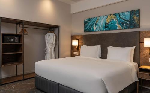 Ένα ή περισσότερα κρεβάτια σε δωμάτιο στο Radisson Hotel and Convention Centre OR Tambo Airport