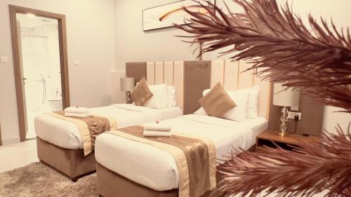 Ένα ή περισσότερα κρεβάτια σε δωμάτιο στο BW Suites & Spa