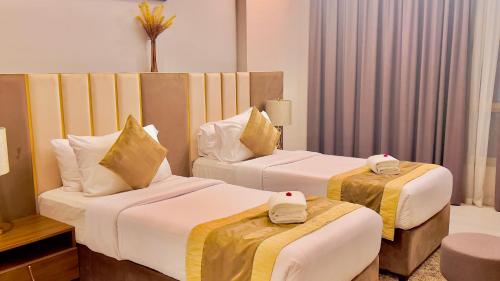Ένα ή περισσότερα κρεβάτια σε δωμάτιο στο BW Suites & Spa