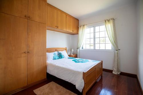 Ένα ή περισσότερα κρεβάτια σε δωμάτιο στο Levada House Prazeres