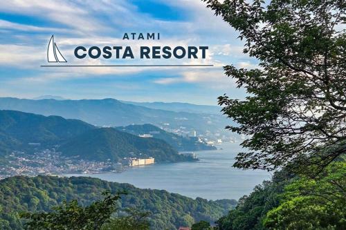 a sign that reads amazon costa resort with a sailboat on a lake at Atami Costa resort with Onsen in Nakano