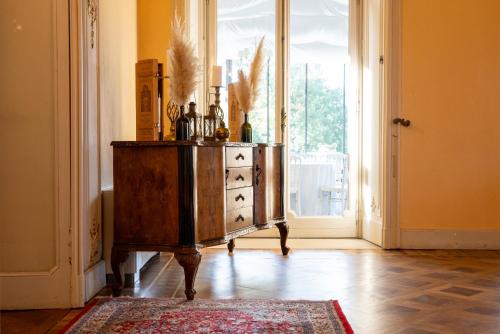 a dresser in a room with a large window at Hotel Villa Borghi in Varano Borghi