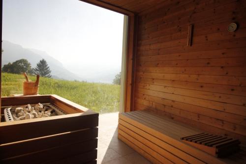 a sauna with a view of a mountain at SKYWAY LOFT - Agenzia Dolomiti Affitti in Cavalese