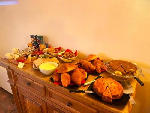 a table with a bunch of food on it at Le Logge del Garda in San Felice del Benaco