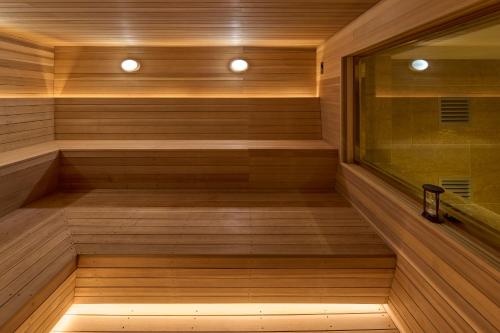 a sauna with a wooden floor and wooden walls at Grand Mercure Imperial Palace Seoul Gangnam in Seoul