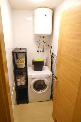 a small bathroom with a washing machine in a room at Sea view La Tejita in Granadilla de Abona