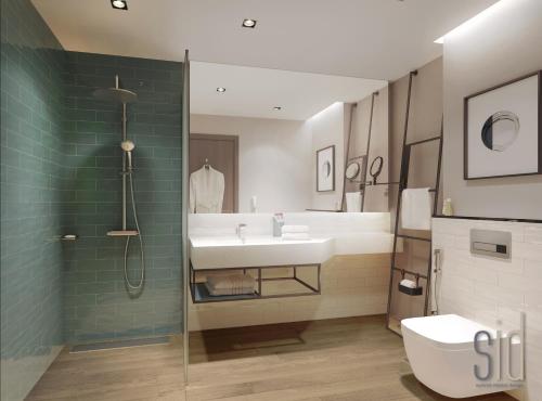 a bathroom with a sink and a shower and a toilet at Four Points by Sheraton King Abdulaziz Road in Riyadh