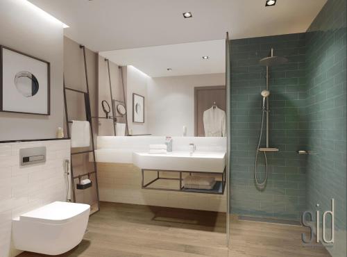 a bathroom with a sink and a toilet and a shower at Four Points by Sheraton King Abdulaziz Road in Riyadh