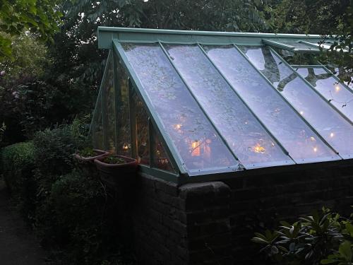 a greenhouse with a bunch of plants in it at Crofton House in Yarm