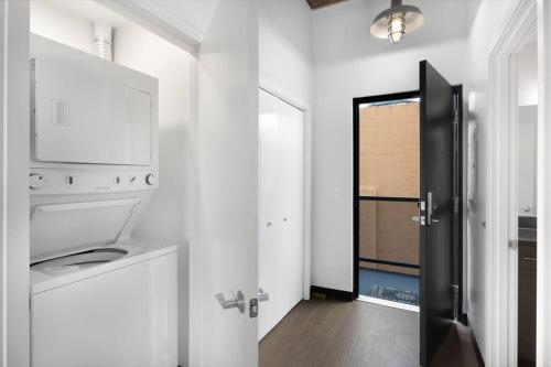 a kitchen with a washer and dryer in a room at Tracyton Condo #202 in Bremerton