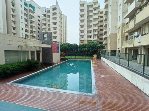 Πισίνα στο ή κοντά στο TAJ SERENITY-Cozy Apartment for 4