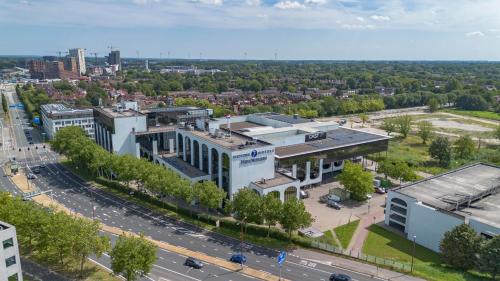 an aerial view of a city with a building at Fletcher Hotel-Restaurant Nieuwegein-Utrecht in Nieuwegein