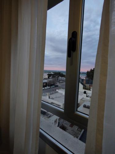 a view of a city from a window at Prismático in Puerto Madryn