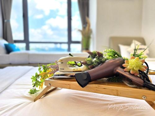 a table with a scale on top of a bed at Cozy Seaview Suite Johor Bahru CIQ in Johor Bahru