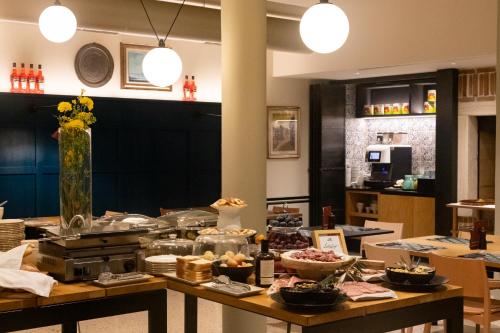 a table with a bunch of food on it at Hotel Laguna - Terme Krka in Strunjan
