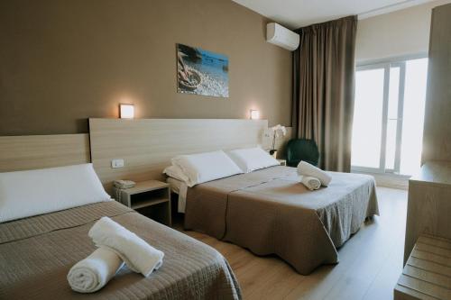 Postel nebo postele na pokoji v ubytování Hotel Holiday