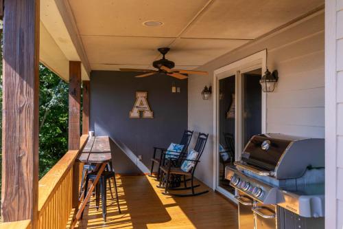 a porch with a grill and a table and chairs at Grandview Getaway in Boone