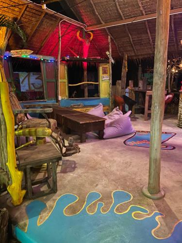 a room with a ping pong table and chairs at Freedom home in Ko Chang