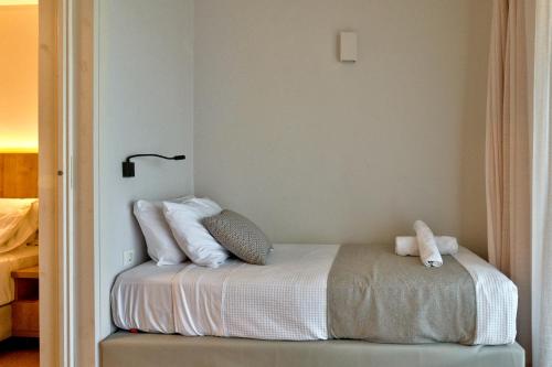 Postel nebo postele na pokoji v ubytování White Olive Elite Rethymno