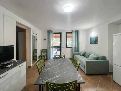 a living room with a table and a couch at Centro Turistico San Nicola in Peschici