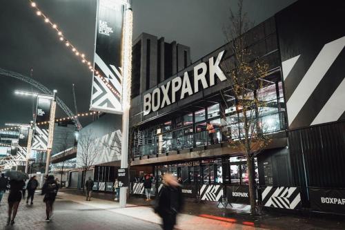 a building with people walking in front of it at Wembley Stadium and OVO Arena Apartment in London