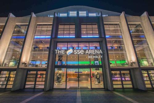 a large building with the see africaagency sign on it at Wembley Stadium and OVO Arena Apartment in London
