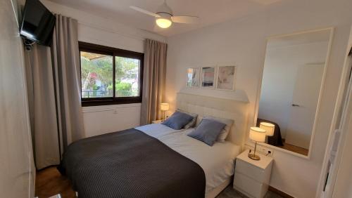 Ένα ή περισσότερα κρεβάτια σε δωμάτιο στο Casa Bonita Cabo Roig - 5 min walk to the beach