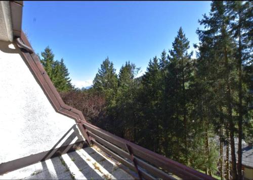 a wooden stairway leading up to some trees at Wuthering Heights in Angolo Terme