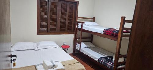 Postel nebo postele na pokoji v ubytování Chácara para Hospedagem e Festa