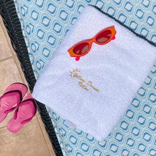a table with a pair of glasses on top of it at Yellow Dream Villas in Chorafakia