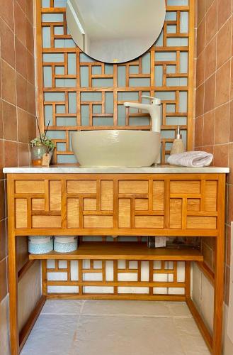 a bathroom with a sink and a mirror at Yellow Dream Villas in Chorafakia