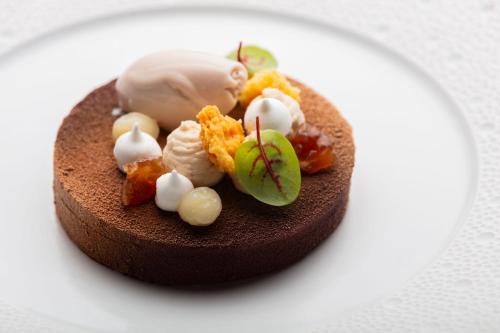a chocolate dessert on a white plate at Bella Vista Hôtel, Suites & Maisons in Porticcio