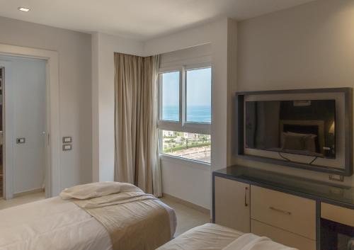 Postel nebo postele na pokoji v ubytování Rhactus House San Stefano