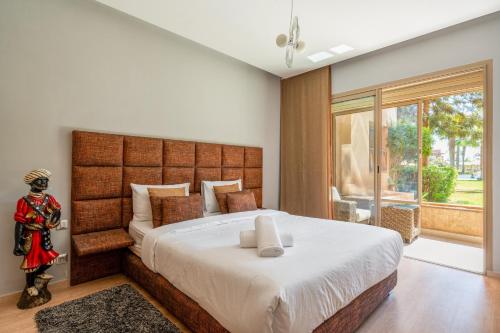 Ένα ή περισσότερα κρεβάτια σε δωμάτιο στο Elegant Apartment in Prestigia Golf Marrakech