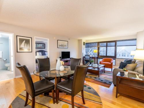 a dining room and living room with a table and chairs at Centrally Located Apt Downtown in Stamford