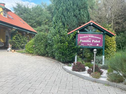a sign for a primitive park in front of a building at Haus mit Garten Familie Pabst in Maria Lankowitz