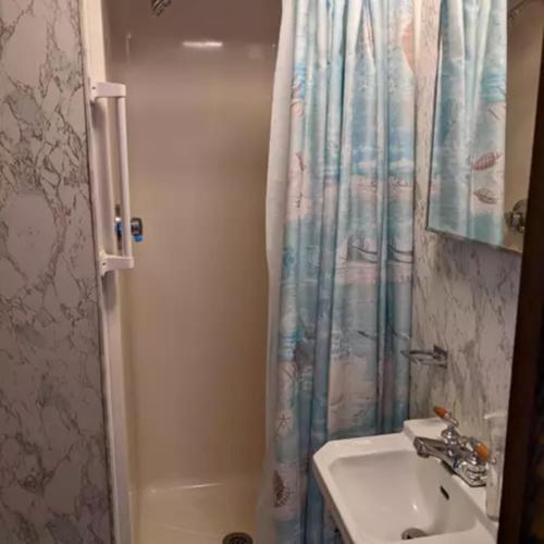 a bathroom with a sink and a shower at Union Bluff Hotel & Meeting House in York Beach