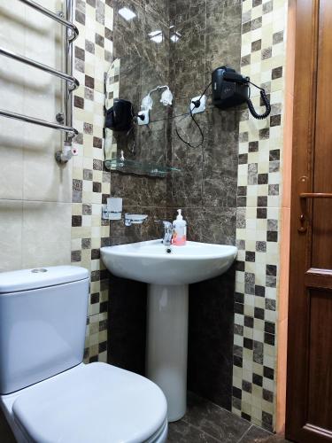 a bathroom with a toilet and a sink at Jermuk Mini Apartment in Jermuk