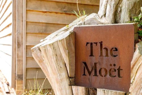 a sign that says the most next to a building at Romantic Countryside Lodge with Hot Tub in North Mundham