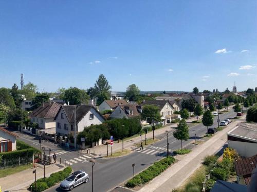 an aerial view of a residential neighborhood with a street at Chez karine 4 in Arpajon