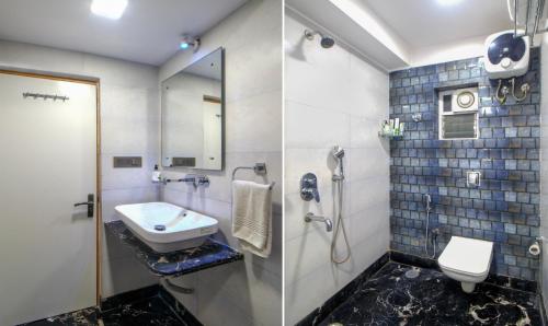 a bathroom with a sink and a shower and a toilet at Hotel Orion Crystal in Kolkata