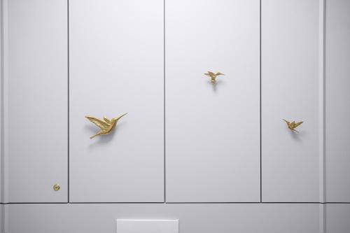 three cabinets with butterflies on them in a kitchen at Sosnowy "3" ,Baseny Tropikalne, Ładowarka do elektryków, Faktura, Parking in Kielce