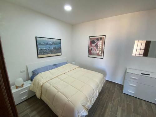 Ένα ή περισσότερα κρεβάτια σε δωμάτιο στο Casa Vancanze BELLAVISTA