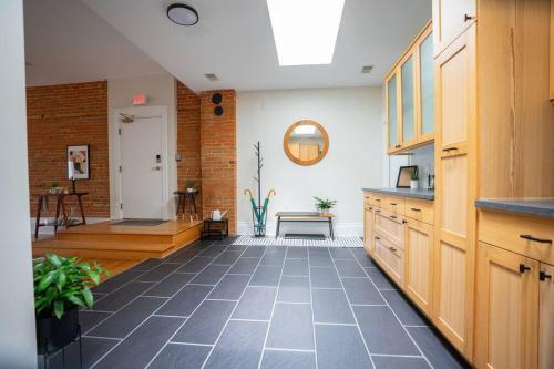 a kitchen with a tile floor in a room at The Getaway in DT Northfield! in Northfield