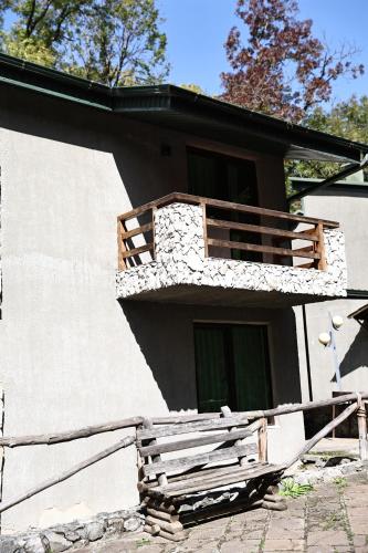 a building with a balcony on the side of it at Dilijan Park Resort & Villas in Dilijan