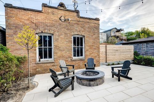 a patio with chairs and a fire pit at Stylish 2BR stunner in unbeatable location in Chicago