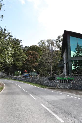 a road with a building on the side of the road at Dilijan Park Resort & Villas in Dilijan